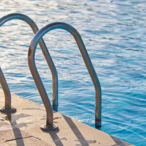 close-up-of-swimming-pool-stainless-steel-handrail-2023-11-27-04-58-54-utc